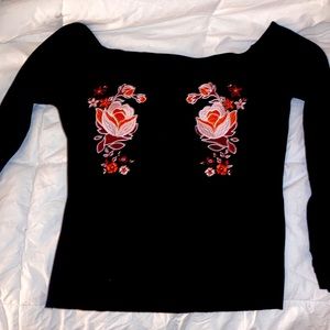 Black, long sleeved top. Super cute flower stitching. Size L